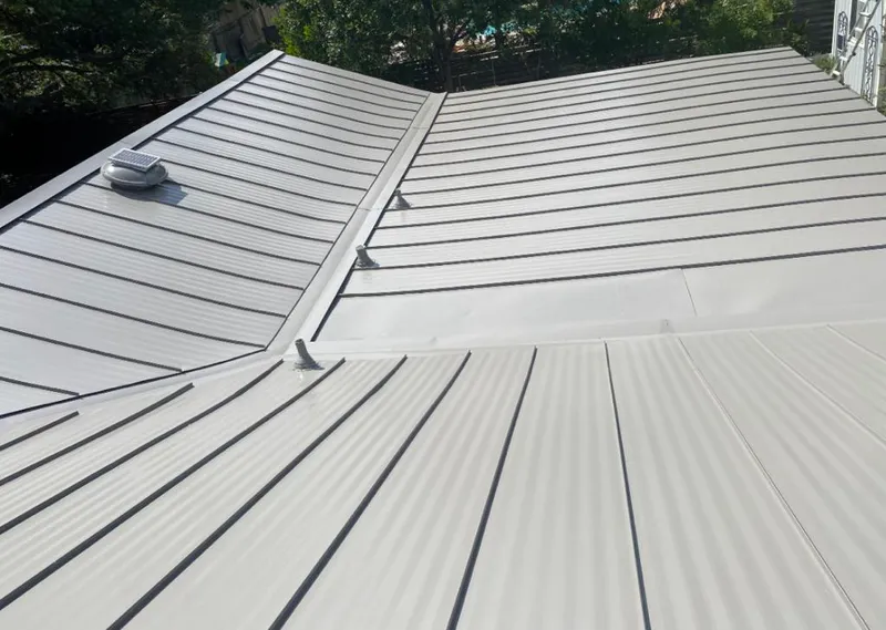 Solar attic fan installed on a metal roof for Roof Ventilation in Roanoke